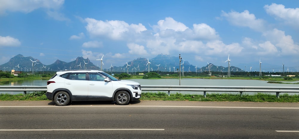 a white car parked on the side of the road