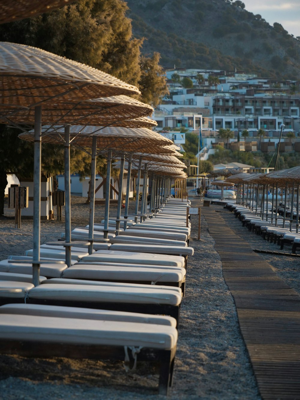 a row of beach chairs sitting next to each other