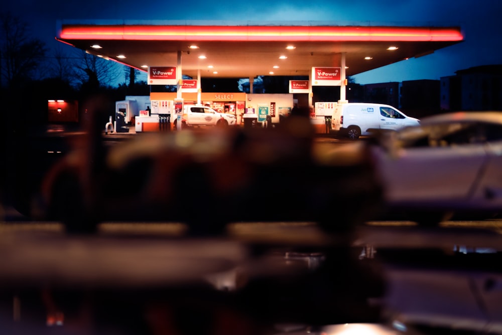 a blurry photo of a gas station at night