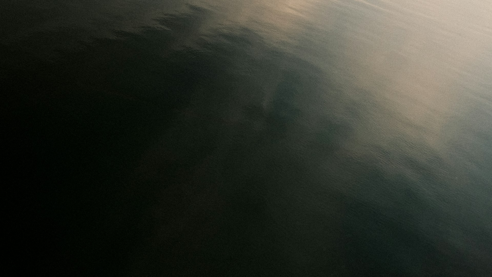 a plane flying over a body of water