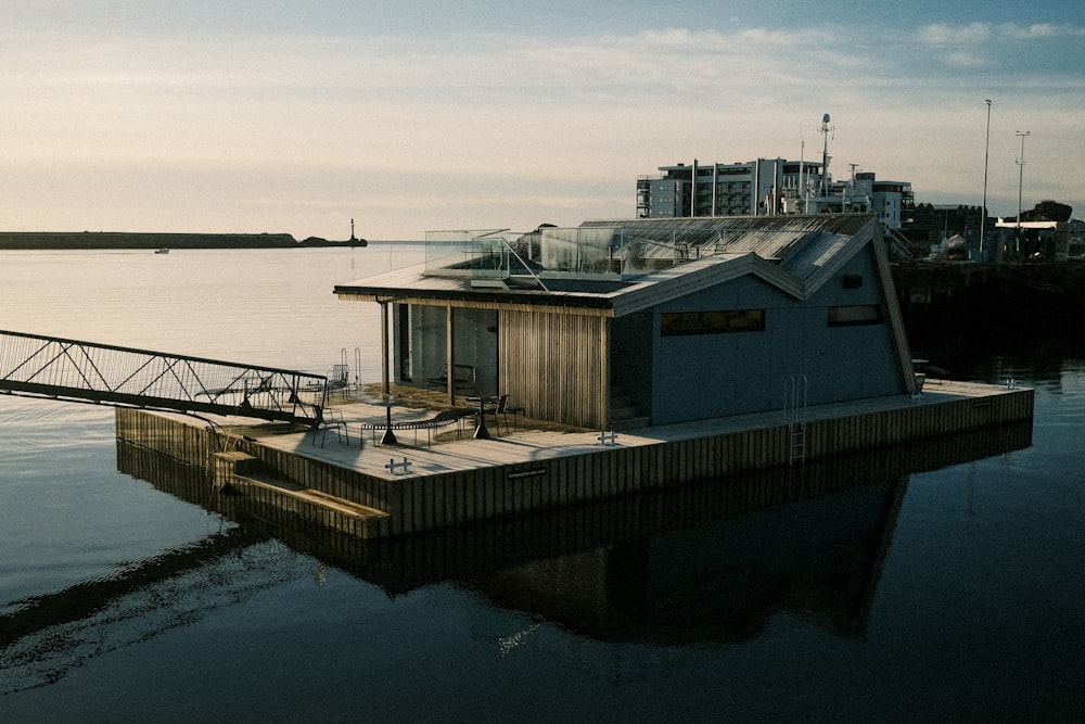 a houseboat floating on top of a body of water