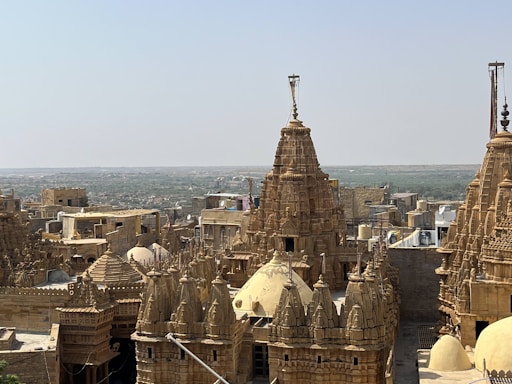 A serene landscape featuring iconic landmarks like the Taj Mahal and Jaipur's forts.