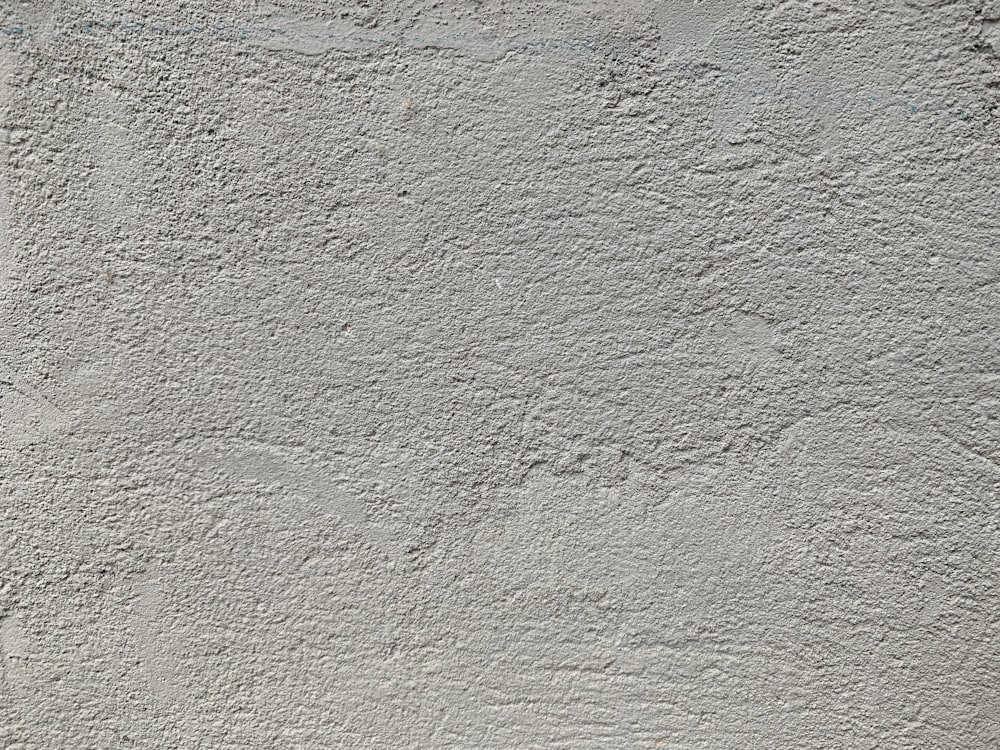 a cement wall with a white background