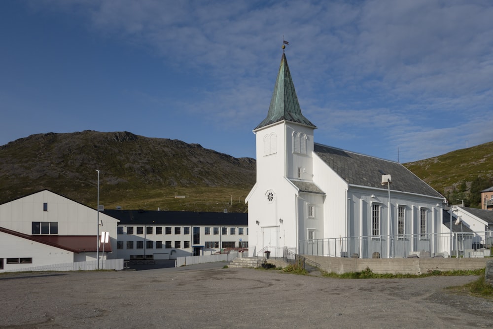 a large white church with a steeple on top of it