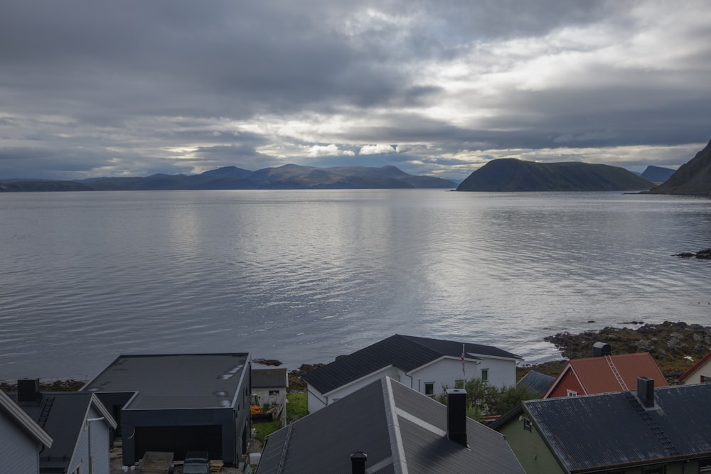 a view of a body of water with houses in the foreground