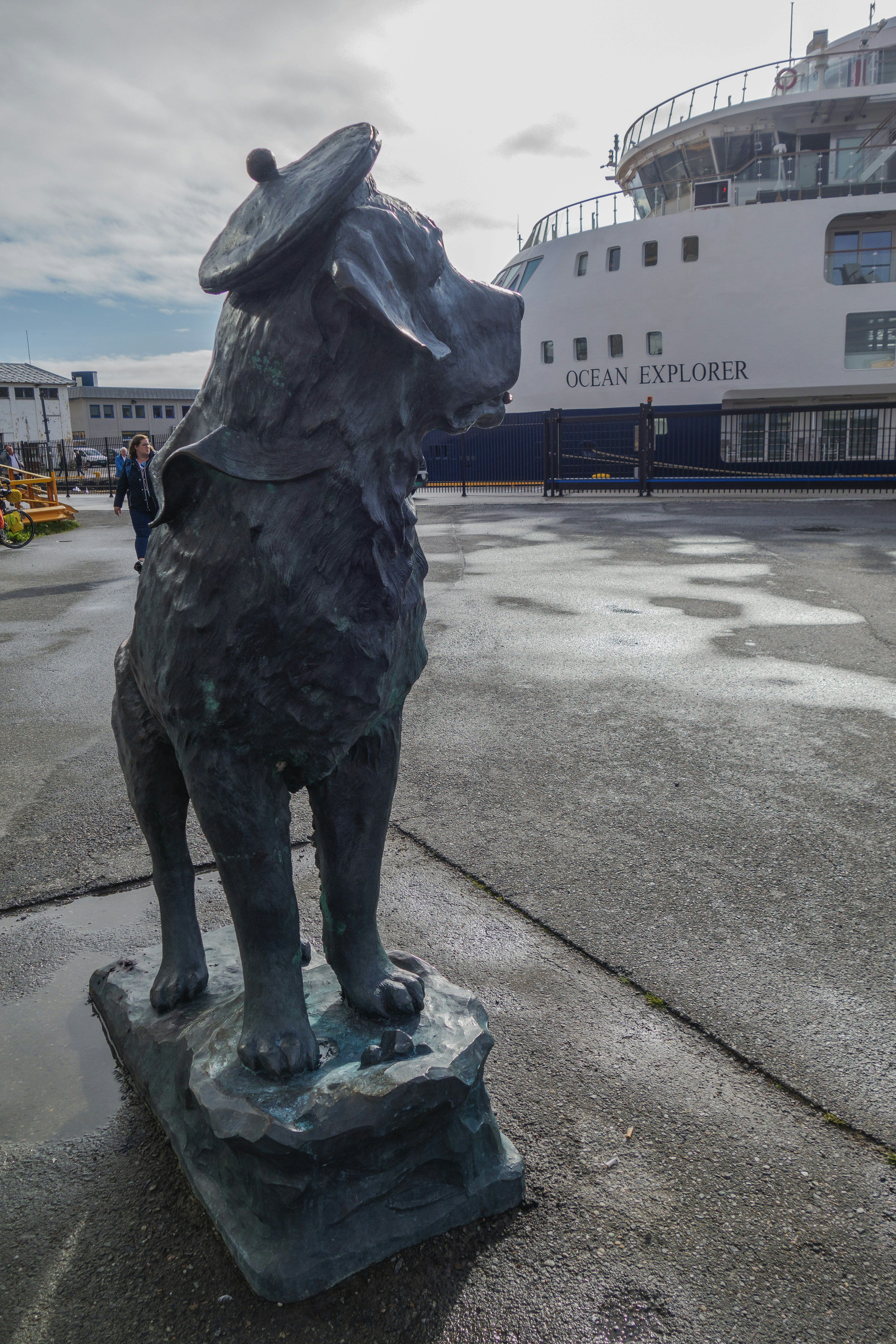 a statue of a dog with a hat on it's head