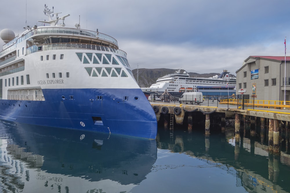 a large cruise ship docked at a dock