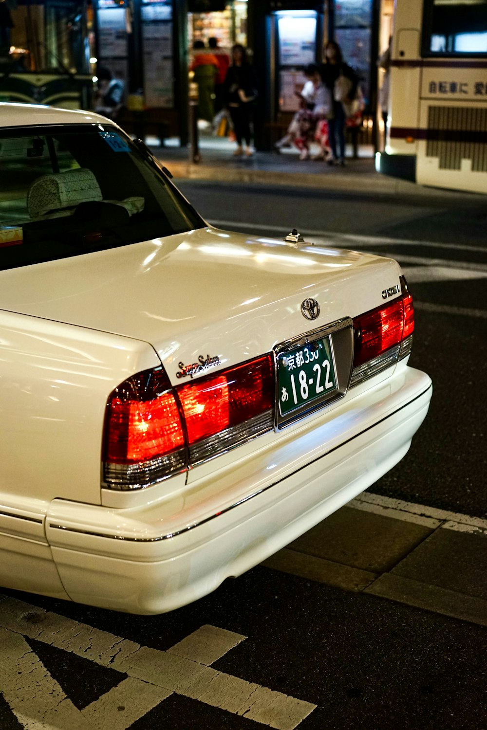 a white car parked on the side of the road