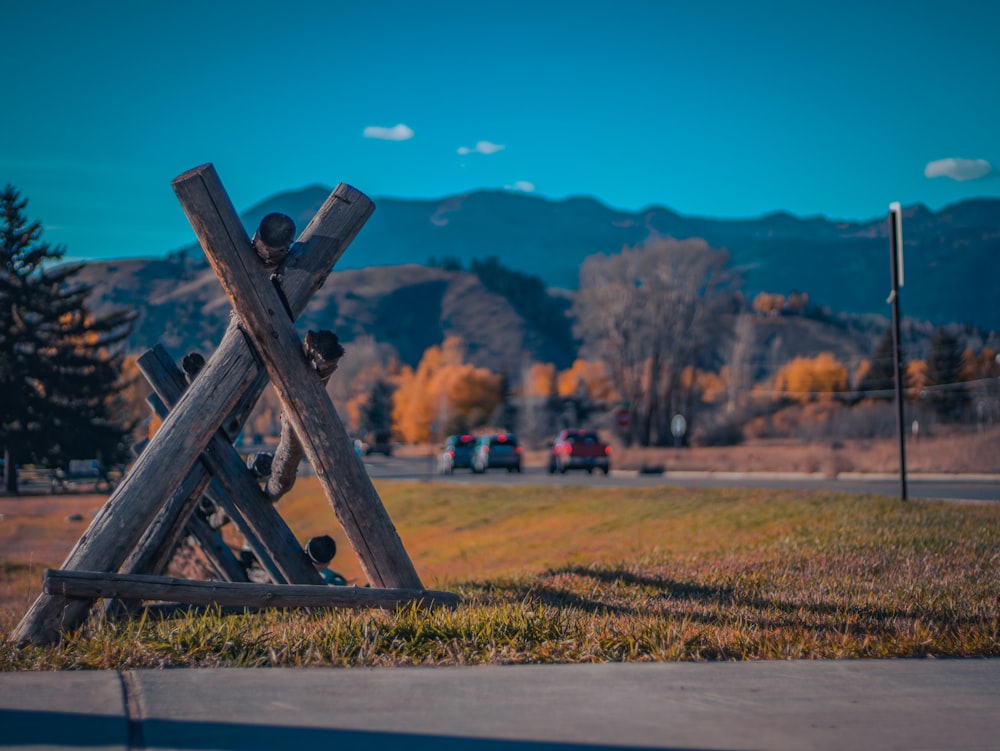 a wooden structure sitting on the side of a road