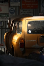 A beautifully restored vintage Volkswagen parked in a sunlit garage.