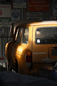 A beautifully restored vintage Volkswagen parked in a sunlit garage.