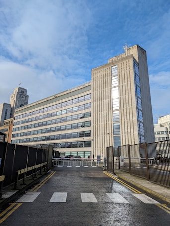 a very tall building sitting on the side of a road