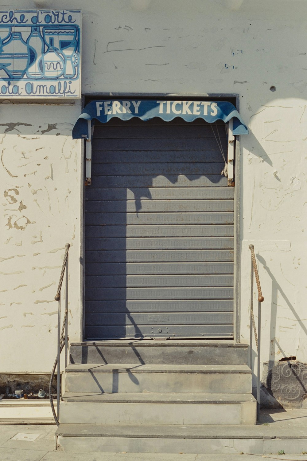a doorway with a sign that says ferry tickets