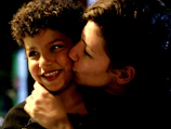 A heartfelt moment of a child hugging a volunteer at a charity event