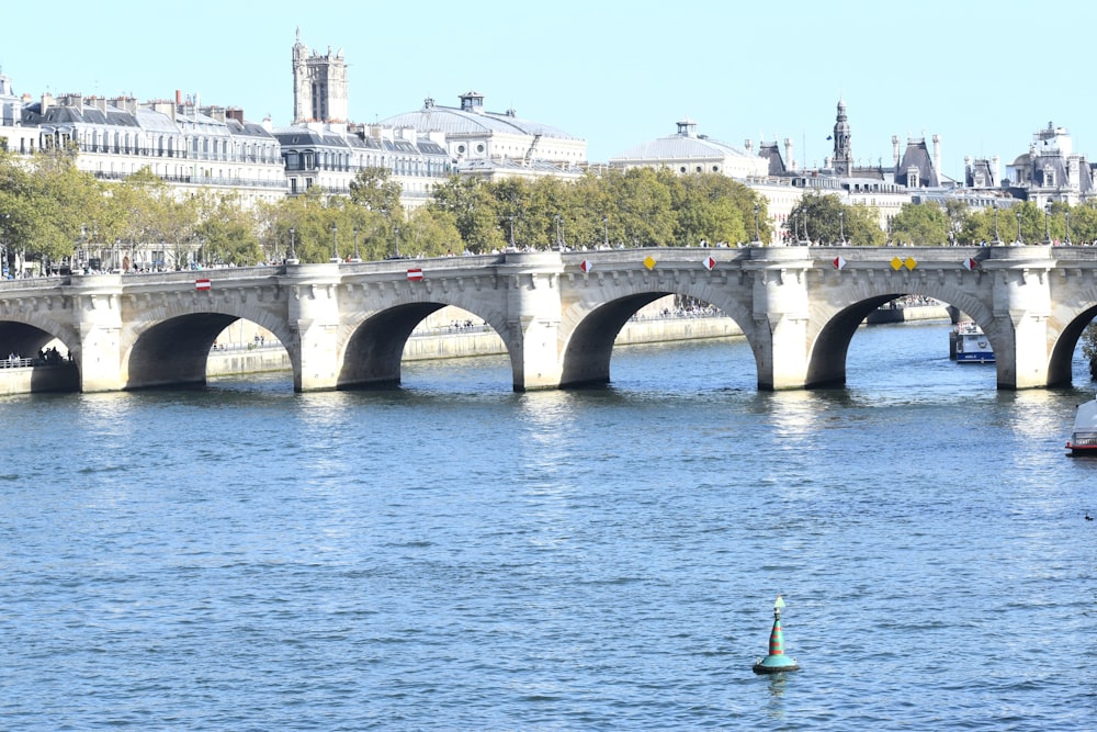 a bridge over a body of water with boats on it