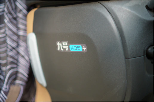 Close-up of a rare promotional collectible from a Chinese streetwear brand, displayed on a sleek dark background.