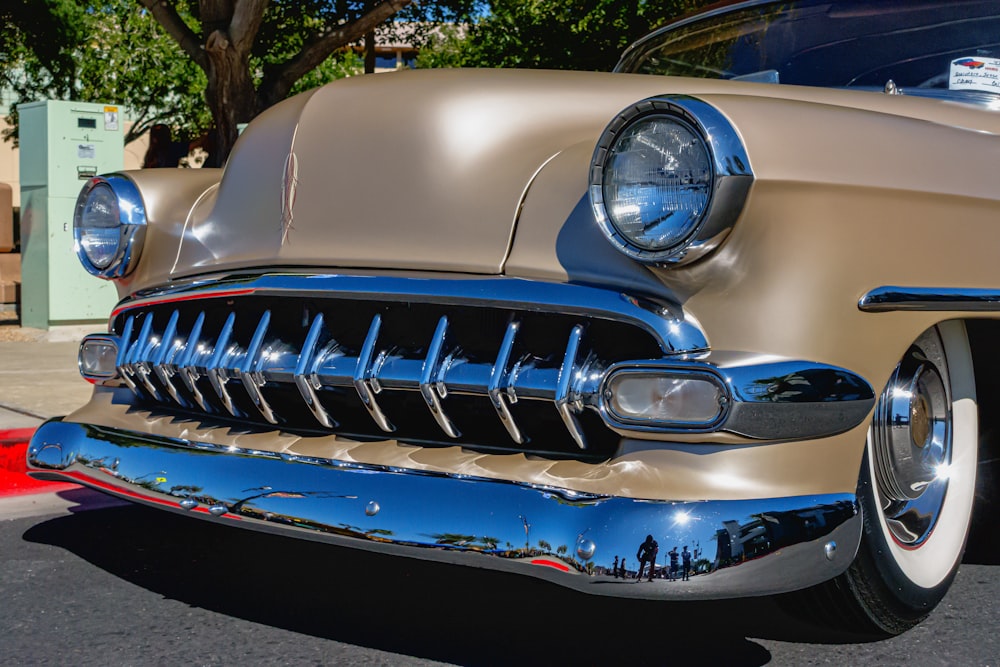 a classic car parked on the side of the road