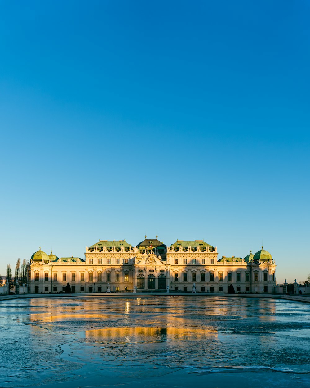 a large building sitting on top of a frozen lake