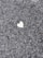 a heart shaped piece of paper on the ground