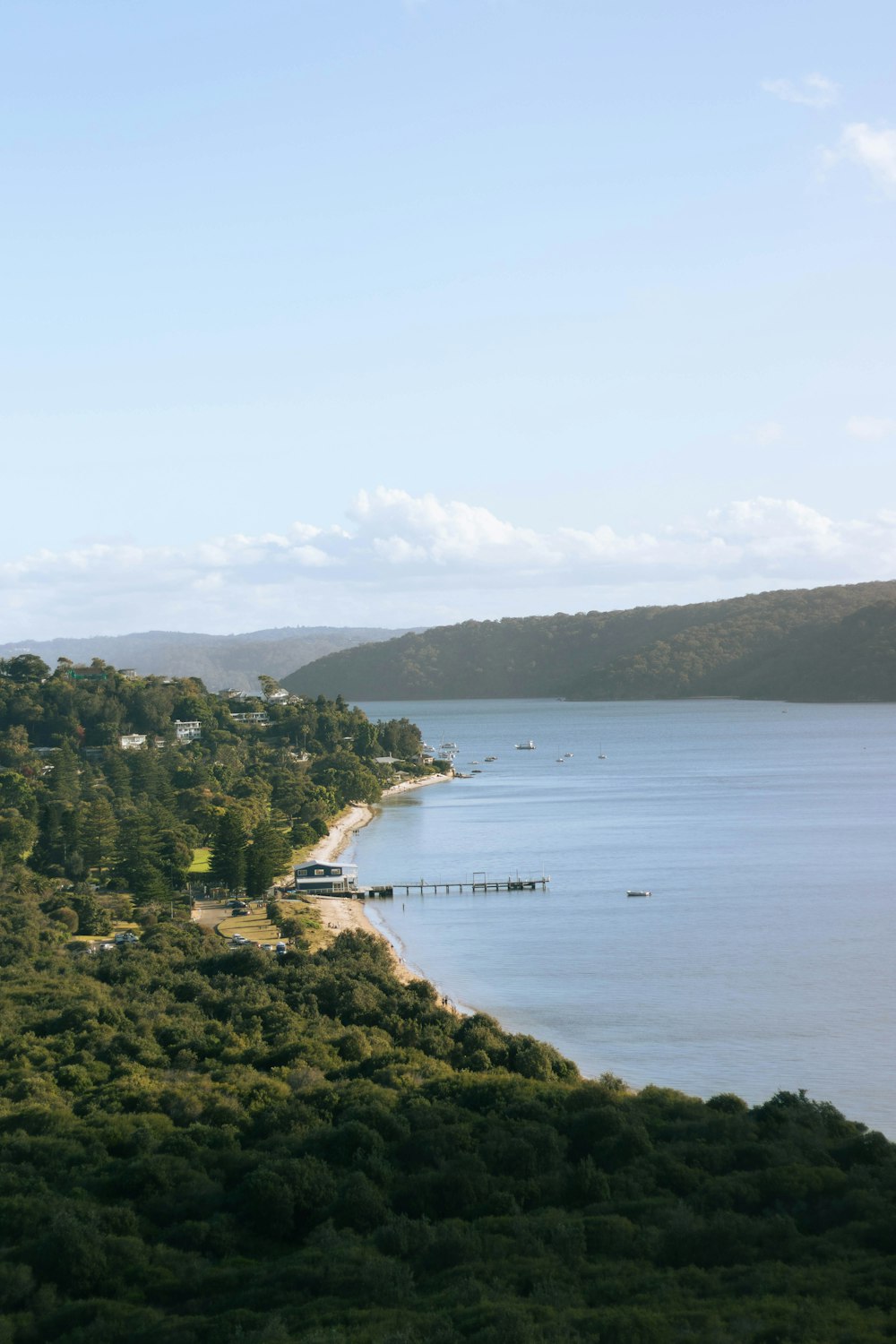 a scenic view of a lake and a beach