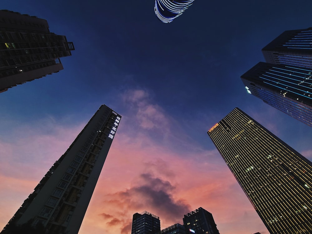 a group of tall buildings under a cloudy sky