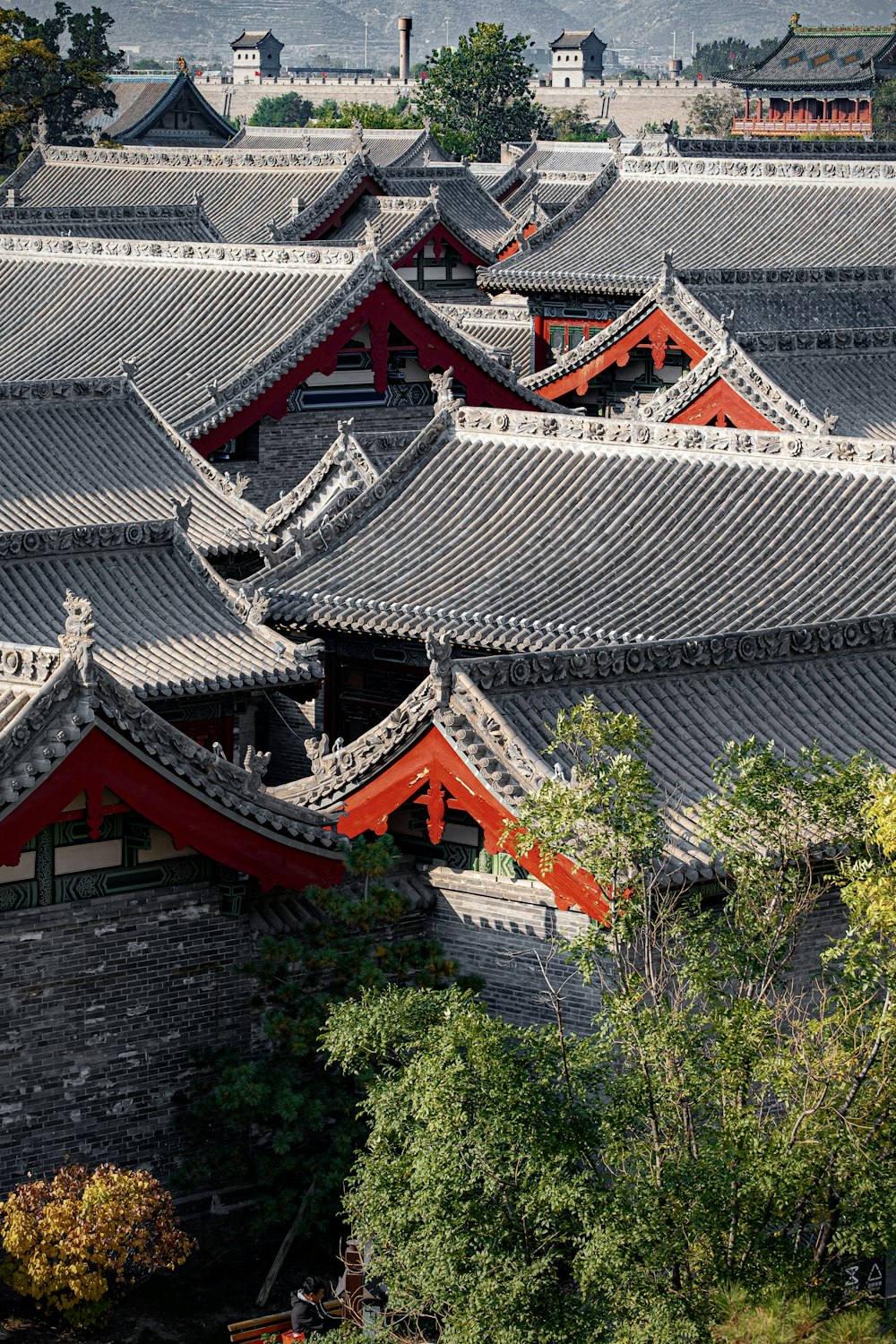 a view of a chinese building with a mountain in the background