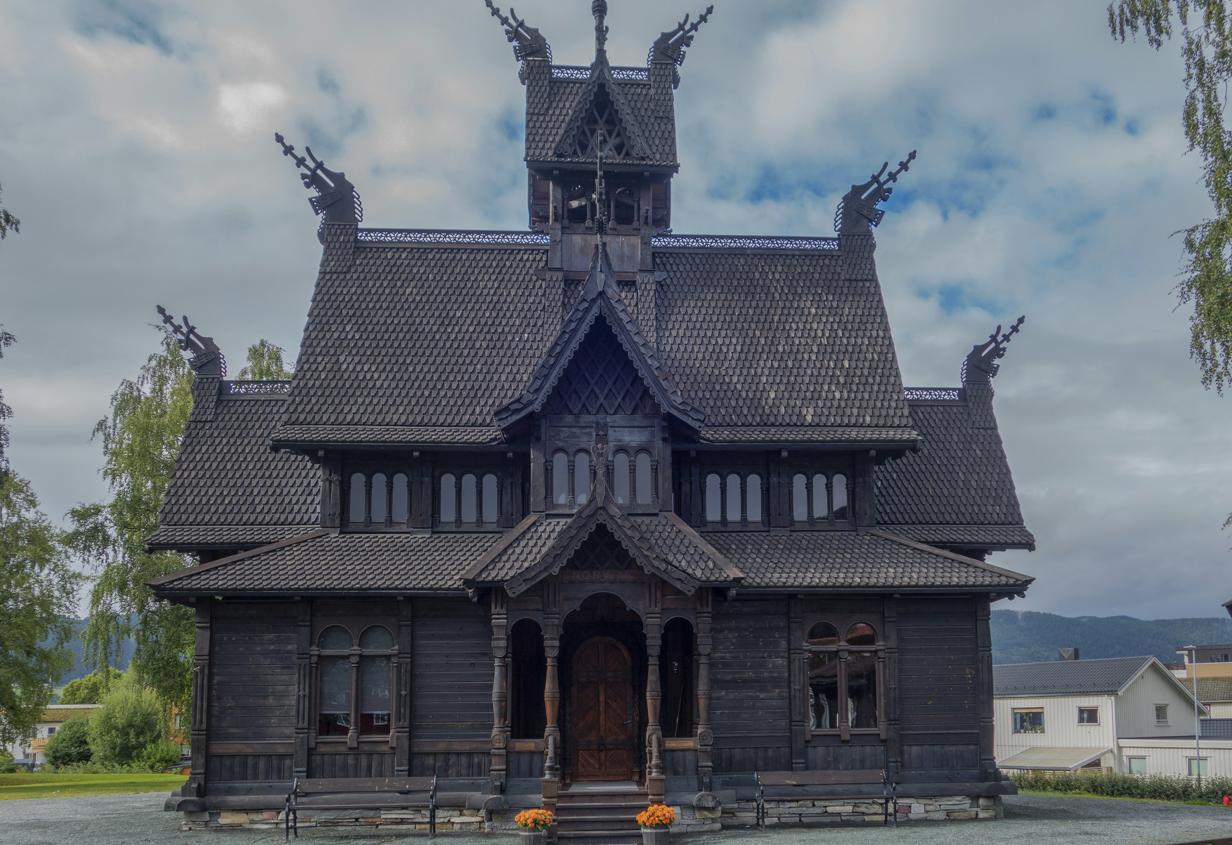 a large wooden building with a clock tower on top of it