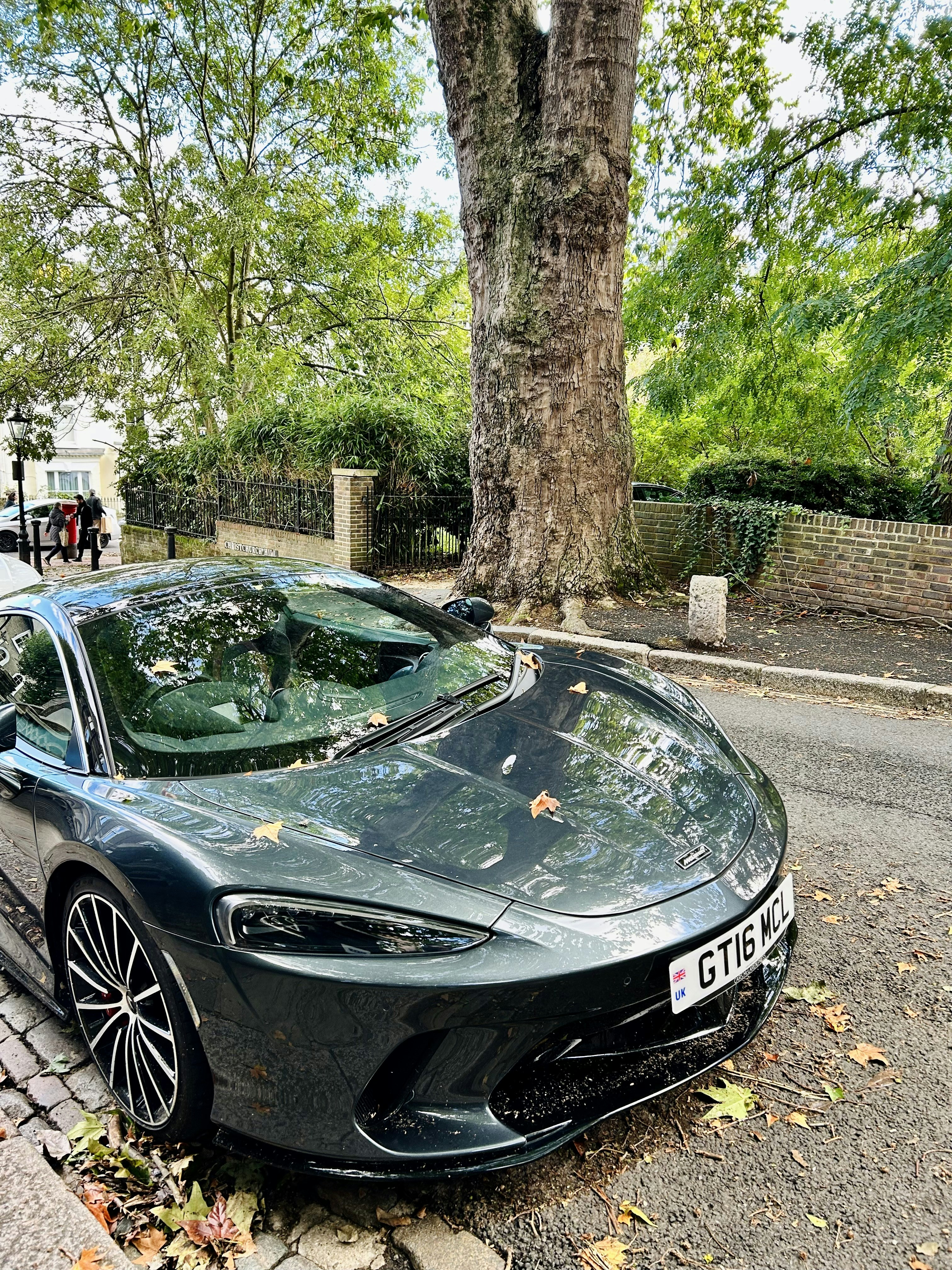 a black sports car parked on the side of the road