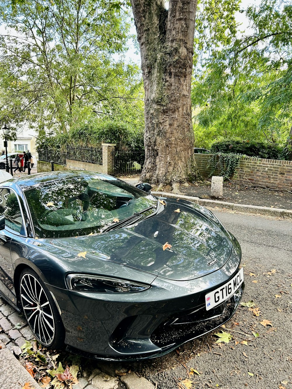 a black sports car parked on the side of the road