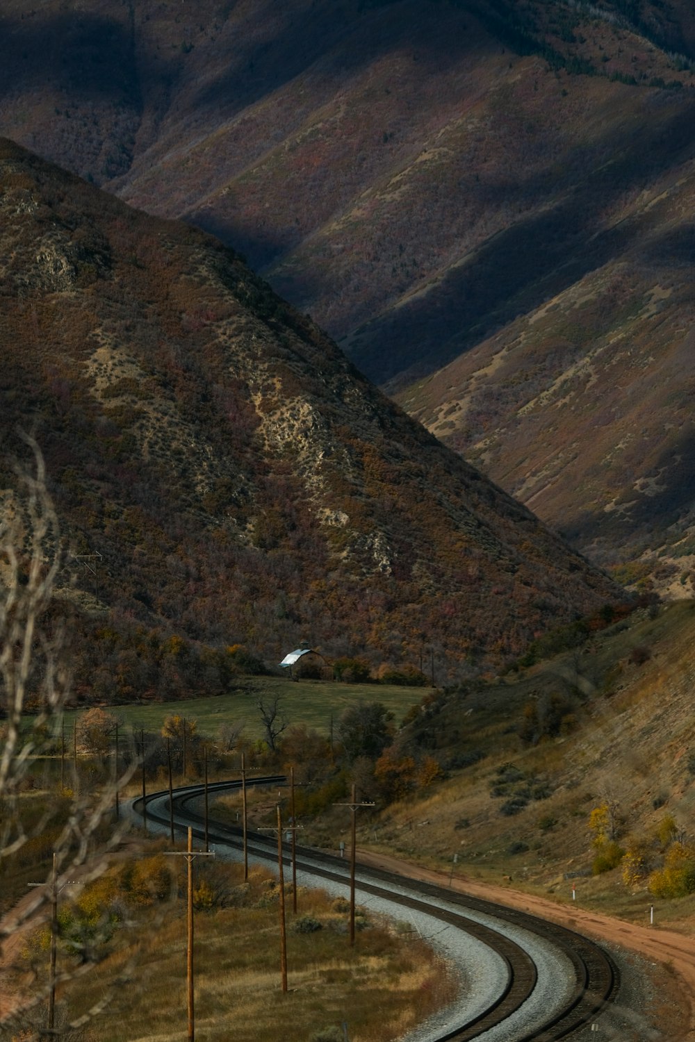 a winding road in the middle of a mountainous area