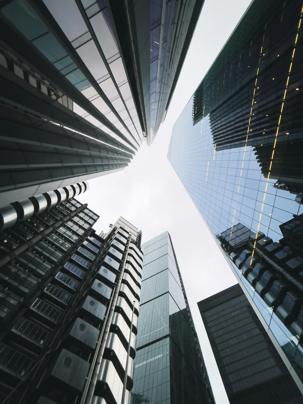 looking up at tall buildings in a city