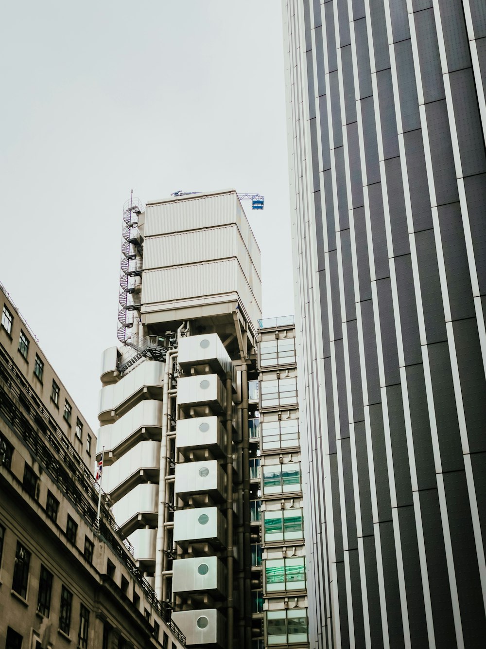 a tall building next to a very tall building