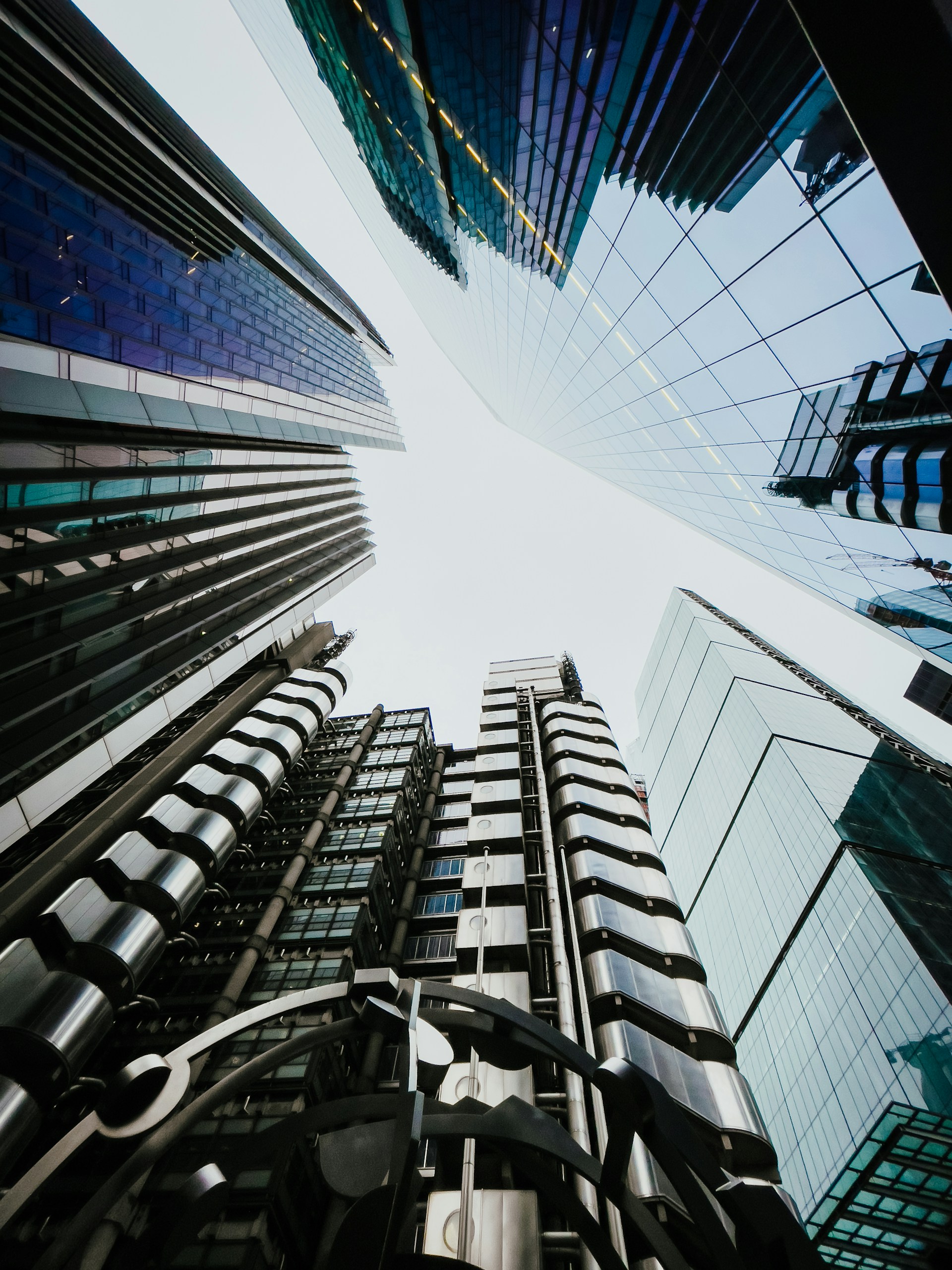 looking up at tall buildings in a city