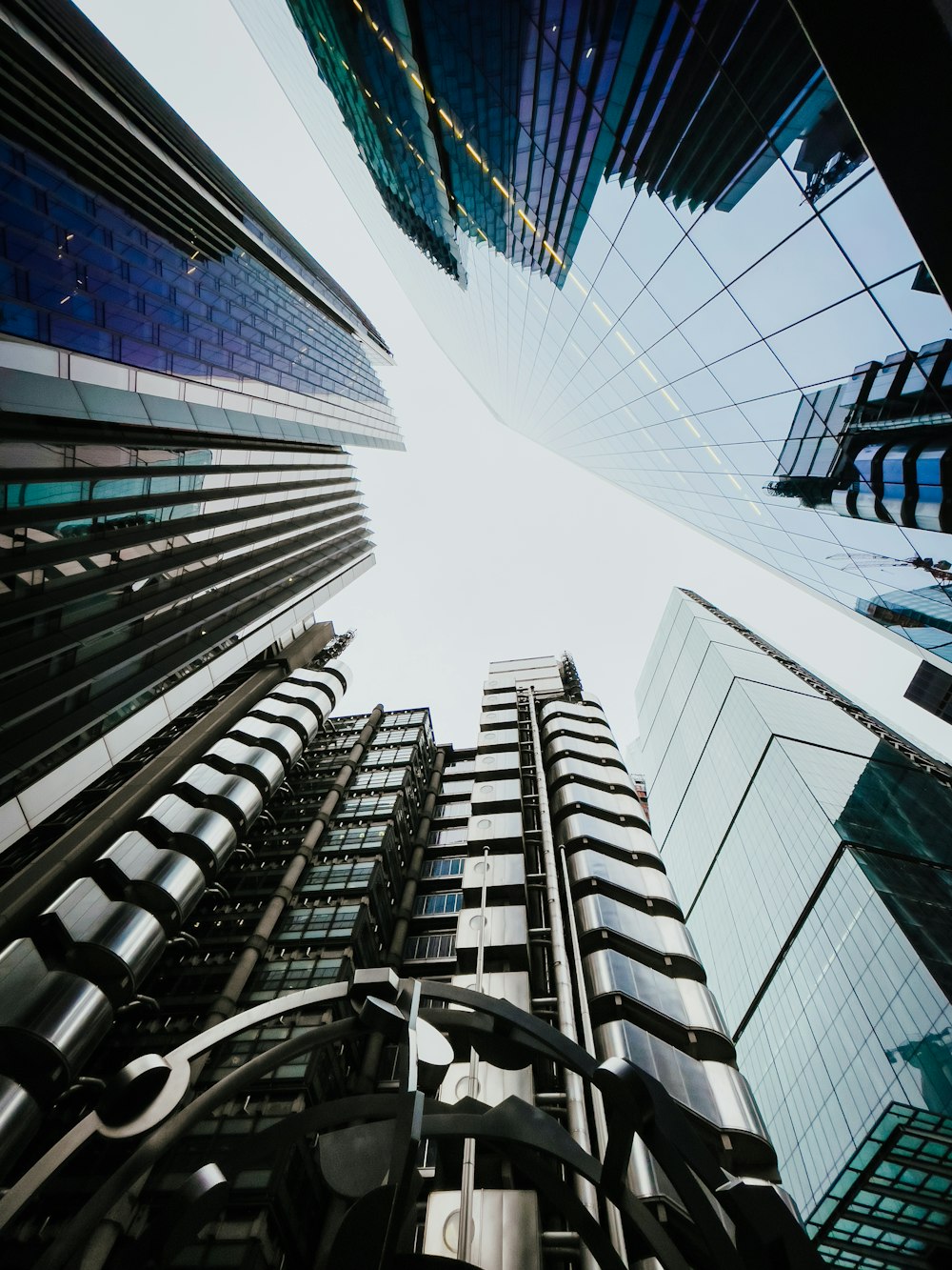 looking up at tall buildings in a city