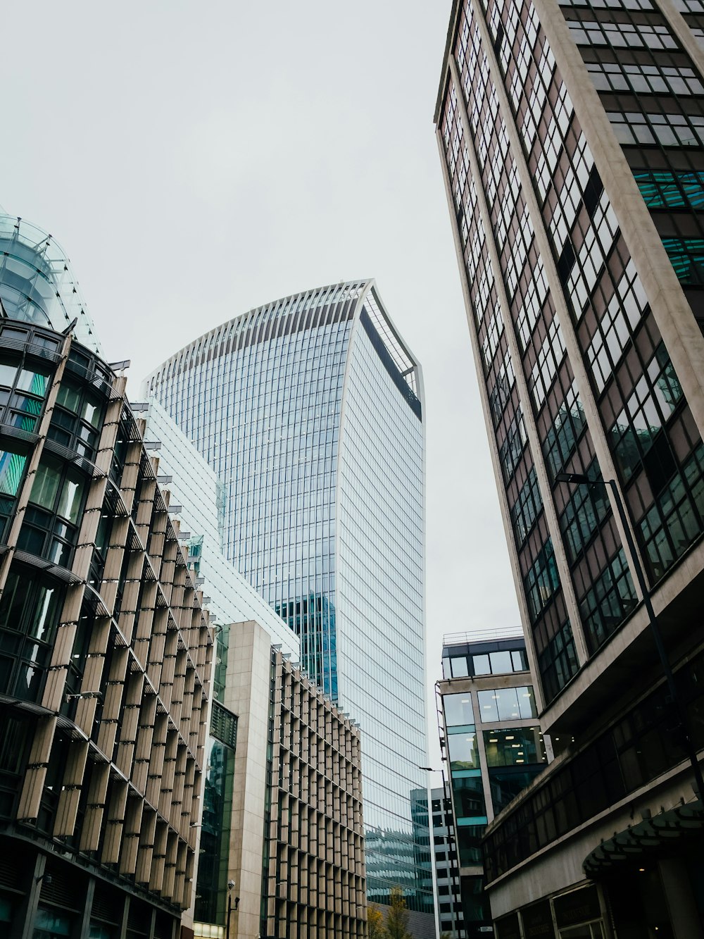 a couple of tall buildings sitting next to each other