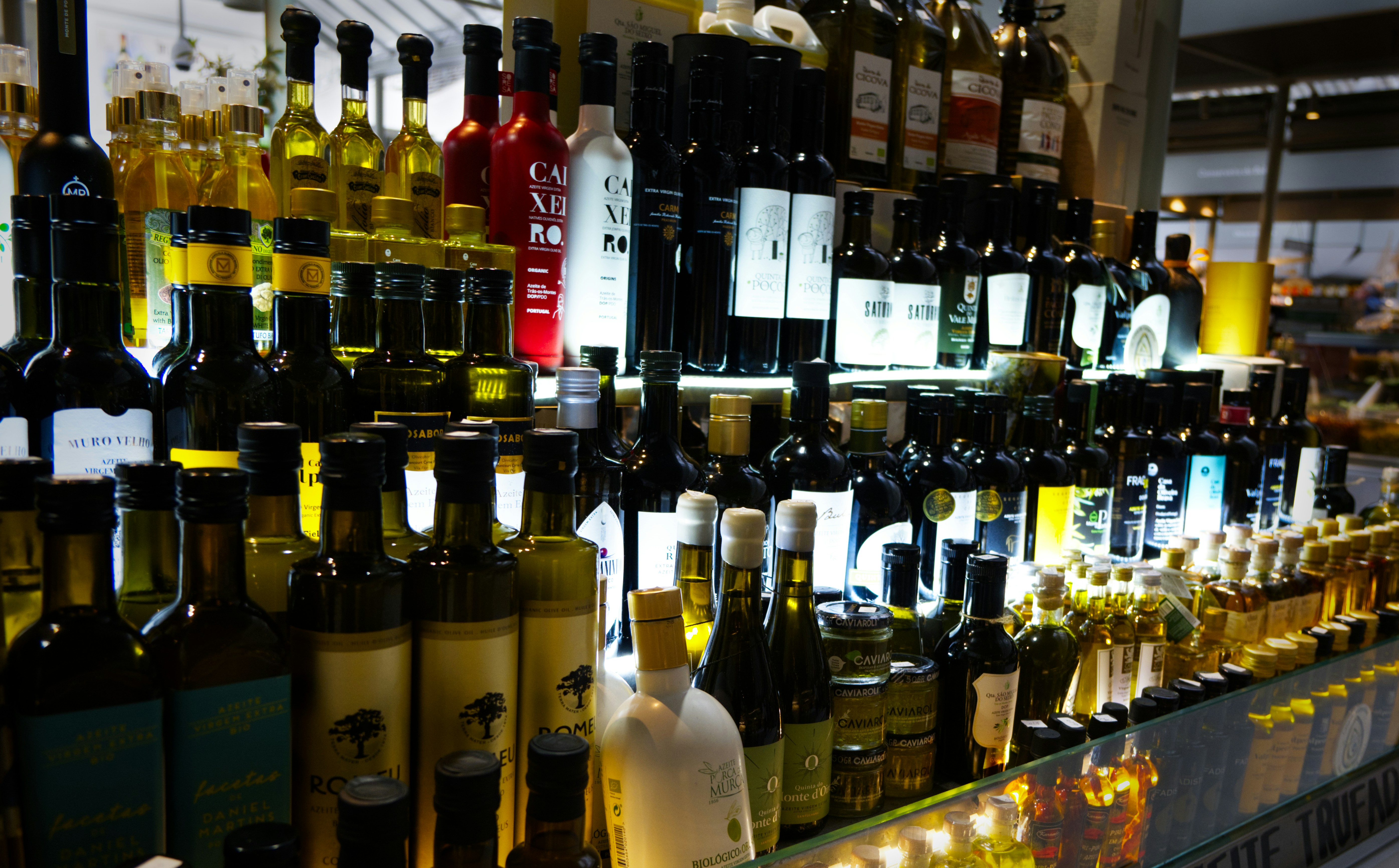 bottles of wine are lined up on a shelf