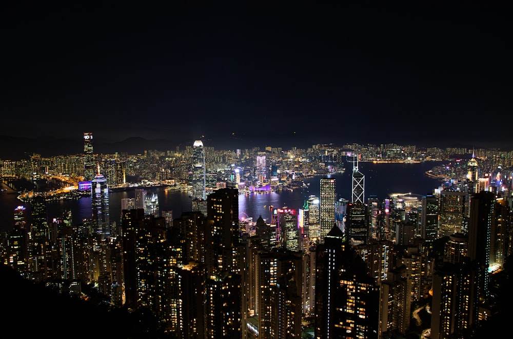 a view of a city at night from the top of a hill