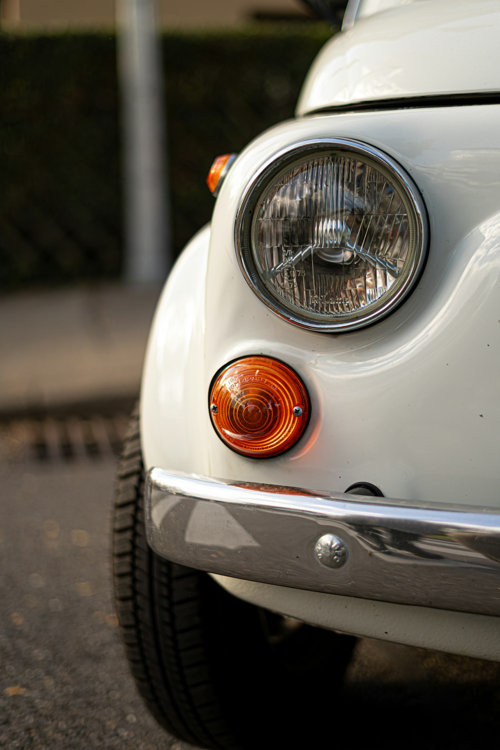 a close up of the front end of a white car
