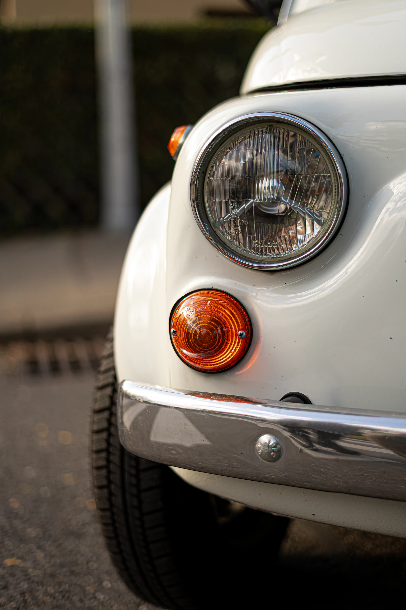 The clean, freshly finished front end of a white car