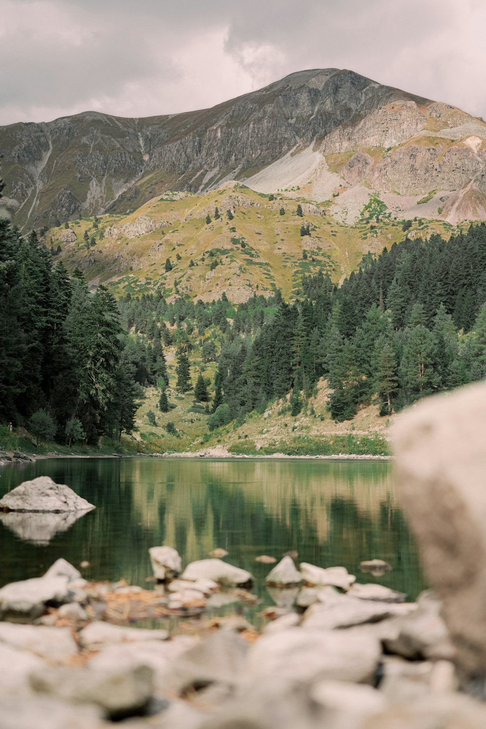 a mountain lake surrounded by rocks and trees