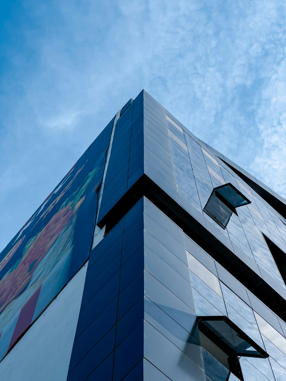 a tall building with a sky background