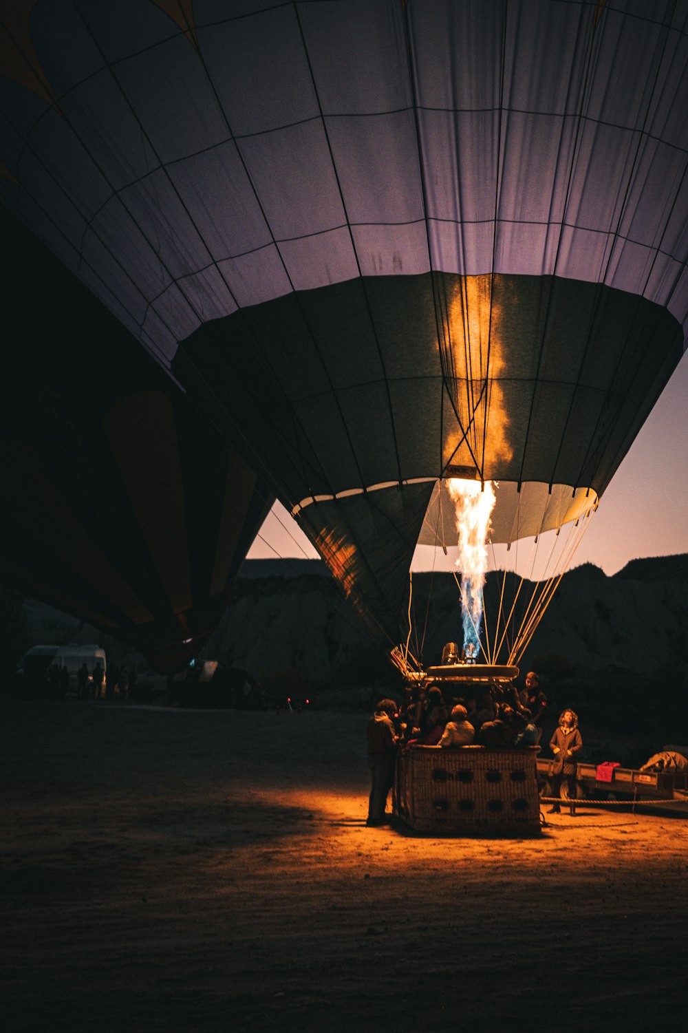 a hot air balloon with a flame coming out of it