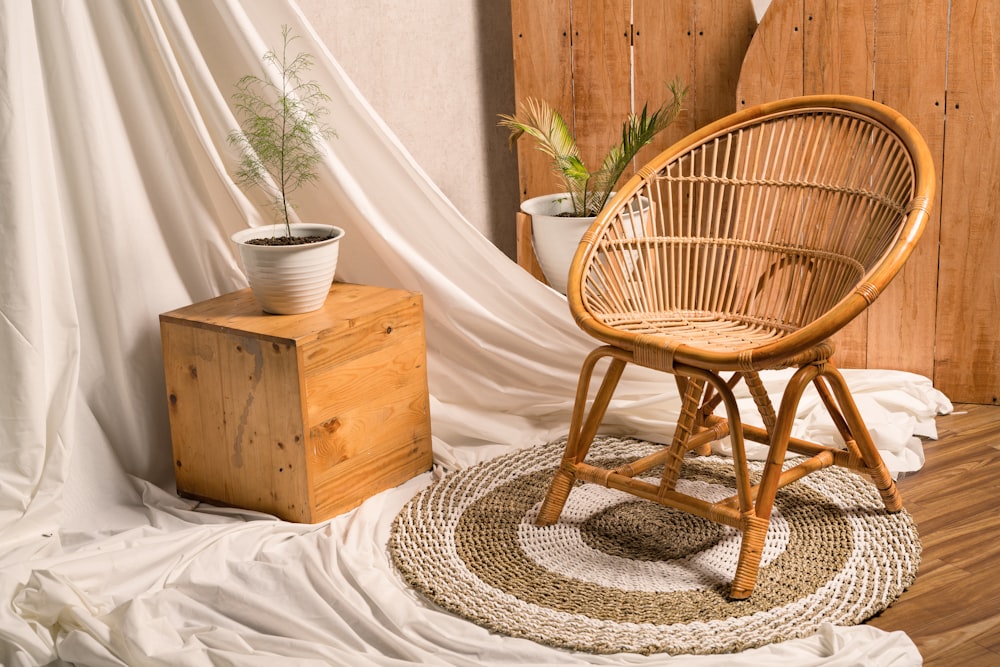 a wicker chair sitting on top of a wooden floor