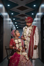 a man and woman dressed in traditional indian garb