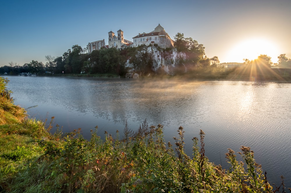 a lake with a castle in the background