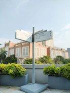 Outdoor wayfinding signs guiding visitors through a corporate campus.