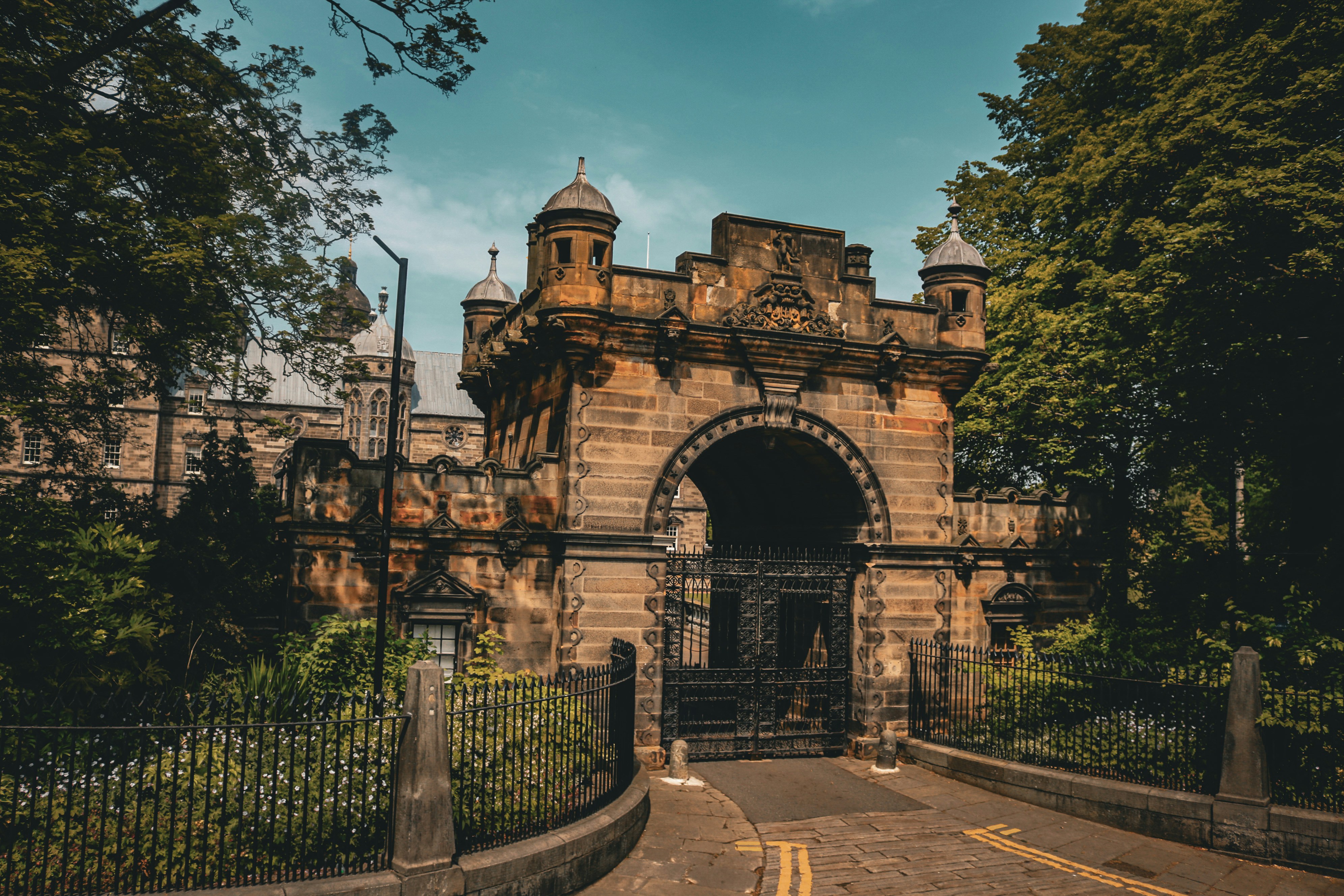 an old building with a gate in front of it