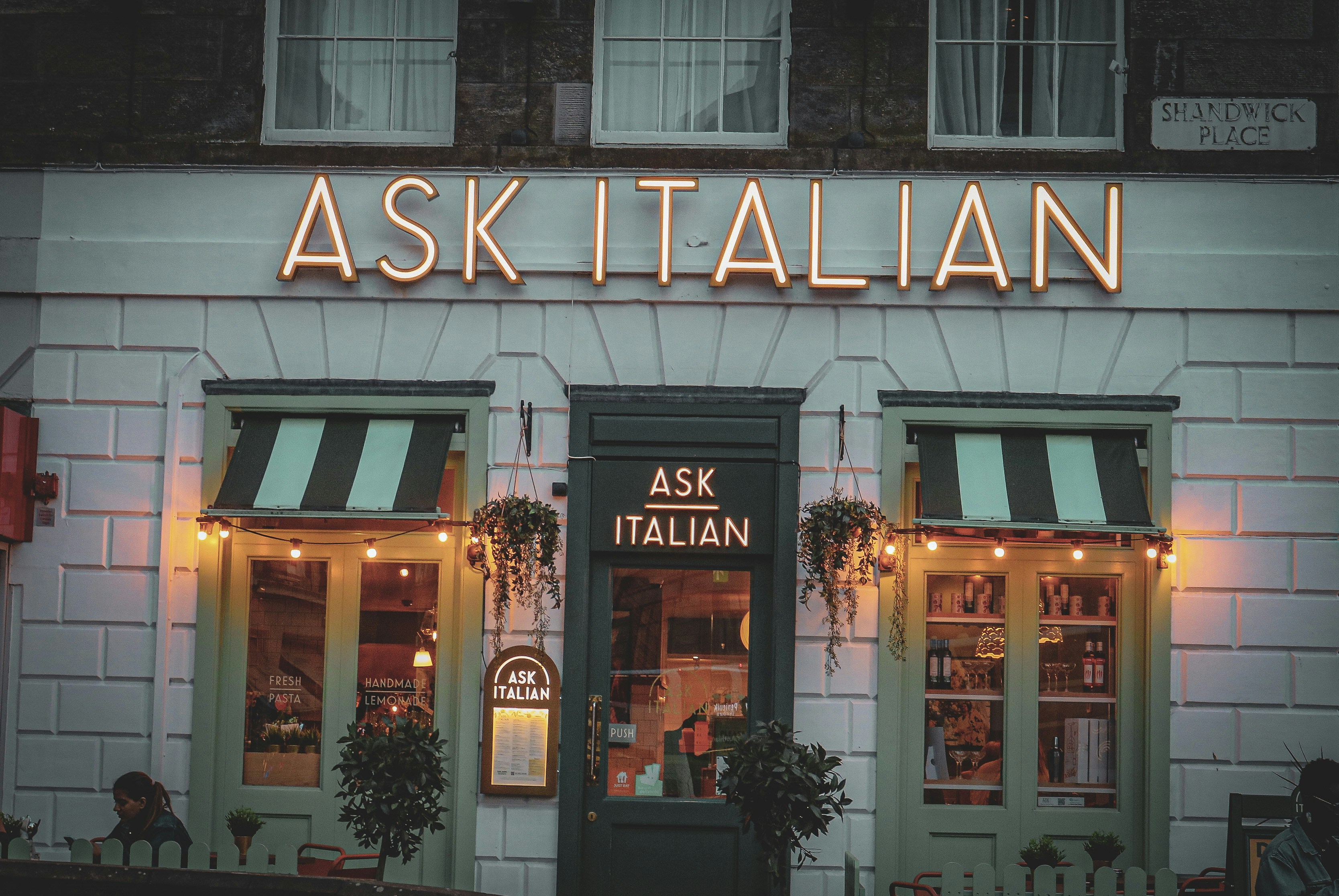 a building with a sign that says ask italian, 