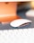 A close-up of a computer accessory on a sleek desk.