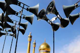 A beautifully installed mosque sound system with elegant speakers mounted near the ceiling.